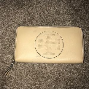 Tory Burch cream colored wallet with blue interior